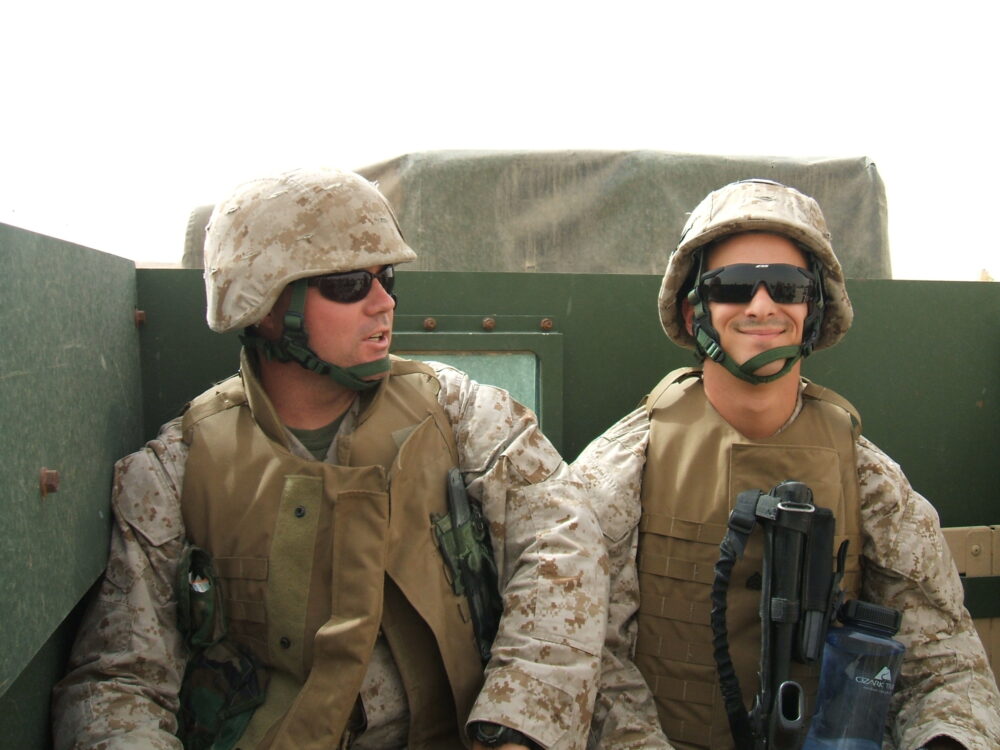 Dan Commuting to Work in the Back of a HMMWV