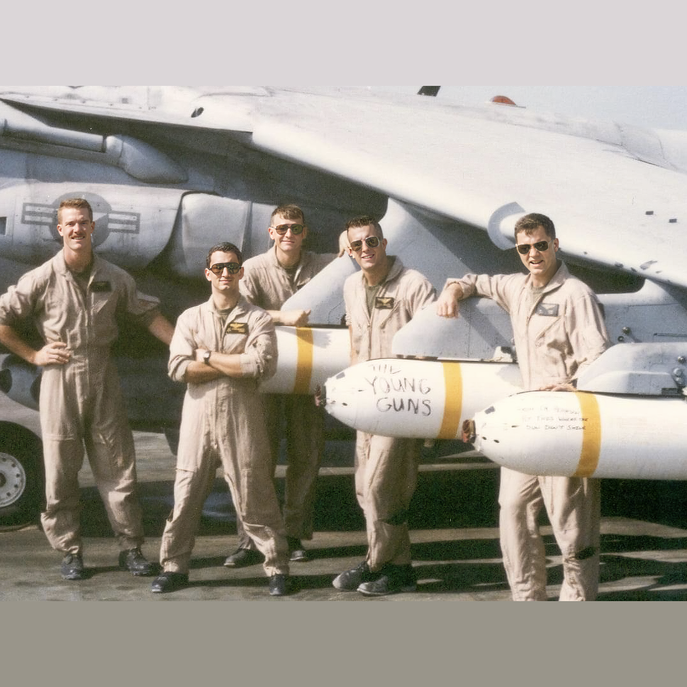 Marine Attack Pilots with a CBU marked "Young Guns"
