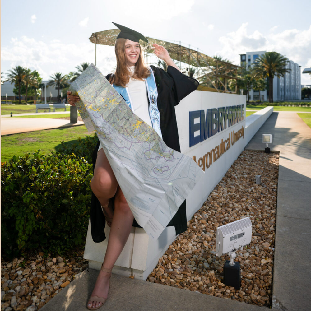 Booz in Front of Embry Riddle Sign