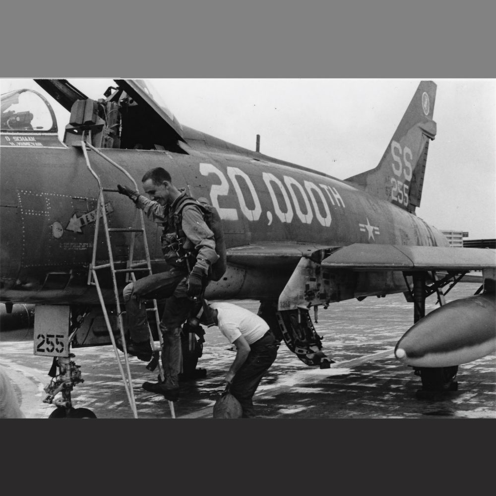 Climbing into an F-100 for the airframe's 20,000th Vietnam Combat Mission